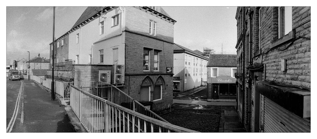 Urban street scene, black and white film panoramic