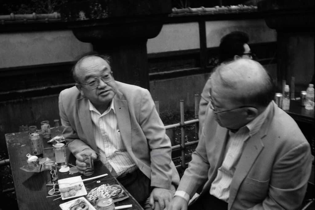 Business buddies in Ueno.Nikon S3 Olympic, with the 35mm W-Nikkor f/3.5 lens, shot on Fomapan 400