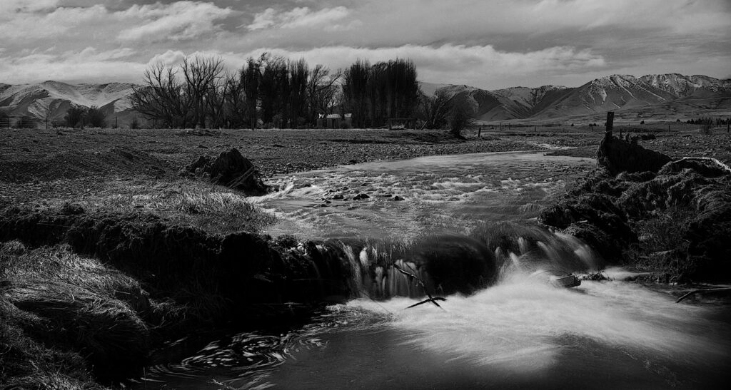 An early shot made with the camera. Snow melt run-off from the mountains swell the water courses in spring.
