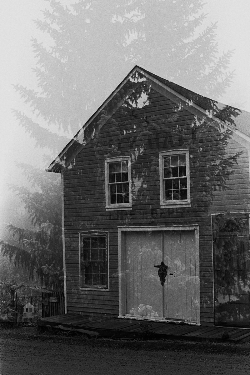 double exposure of city hall building in Navadaville with fog