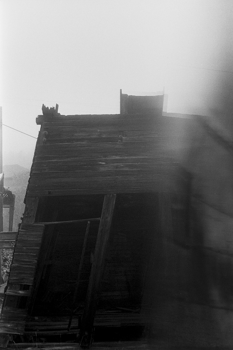 a leaning dilapidated building in ghost town