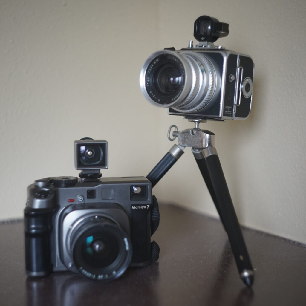 Mamiya 7 with 43mm lens and finder and Hasselblad SWC on a small tripod.