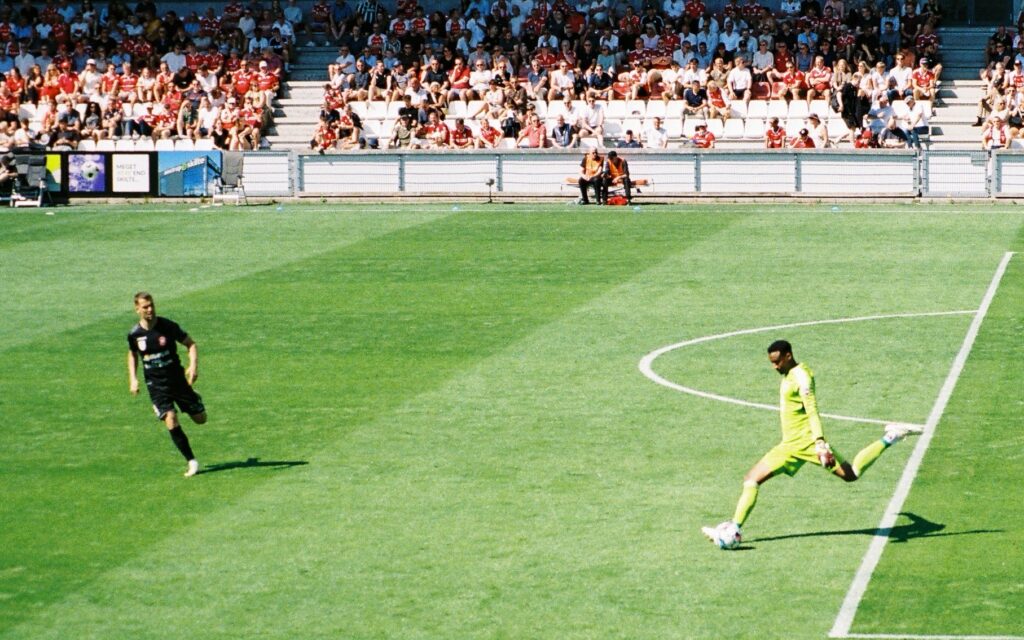 Goalkeeper shooting football