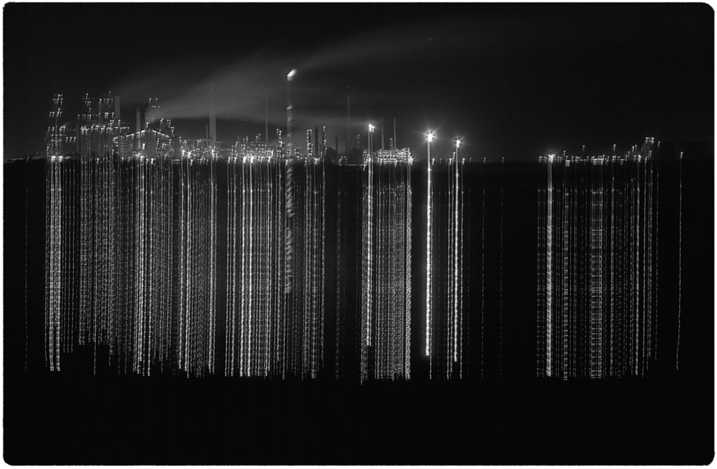 Oil refinery at night - camera raised on tripod during exposure.