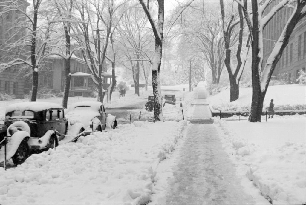 Snow scene with parked cars in Chicago Illinois ca. 1940.
