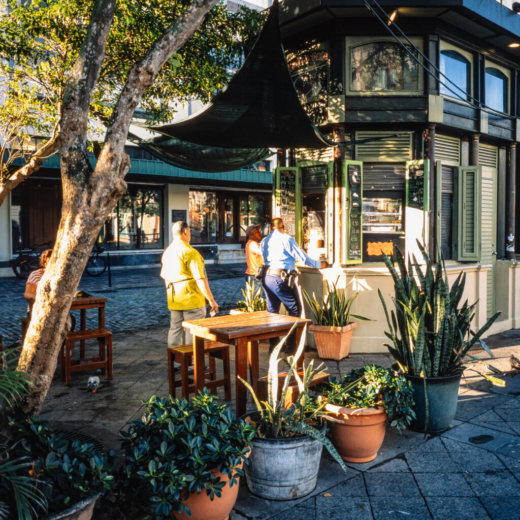 Street cafe with lined up patrons