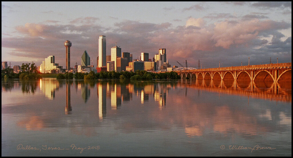 Trinity River at flood stage with Dallas, Texas skyline in background