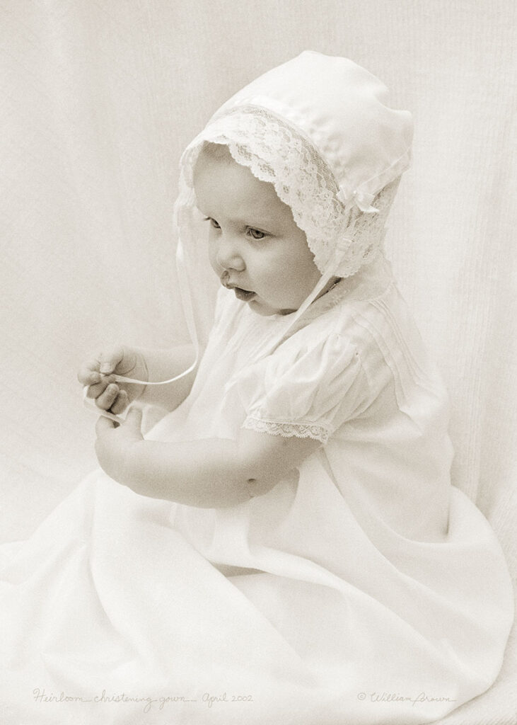 Baby in family heirloom christening gown