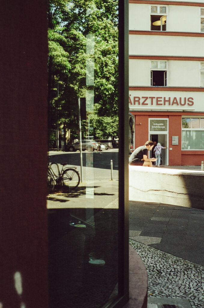 A man checks his phone at lunchtime in Berlin