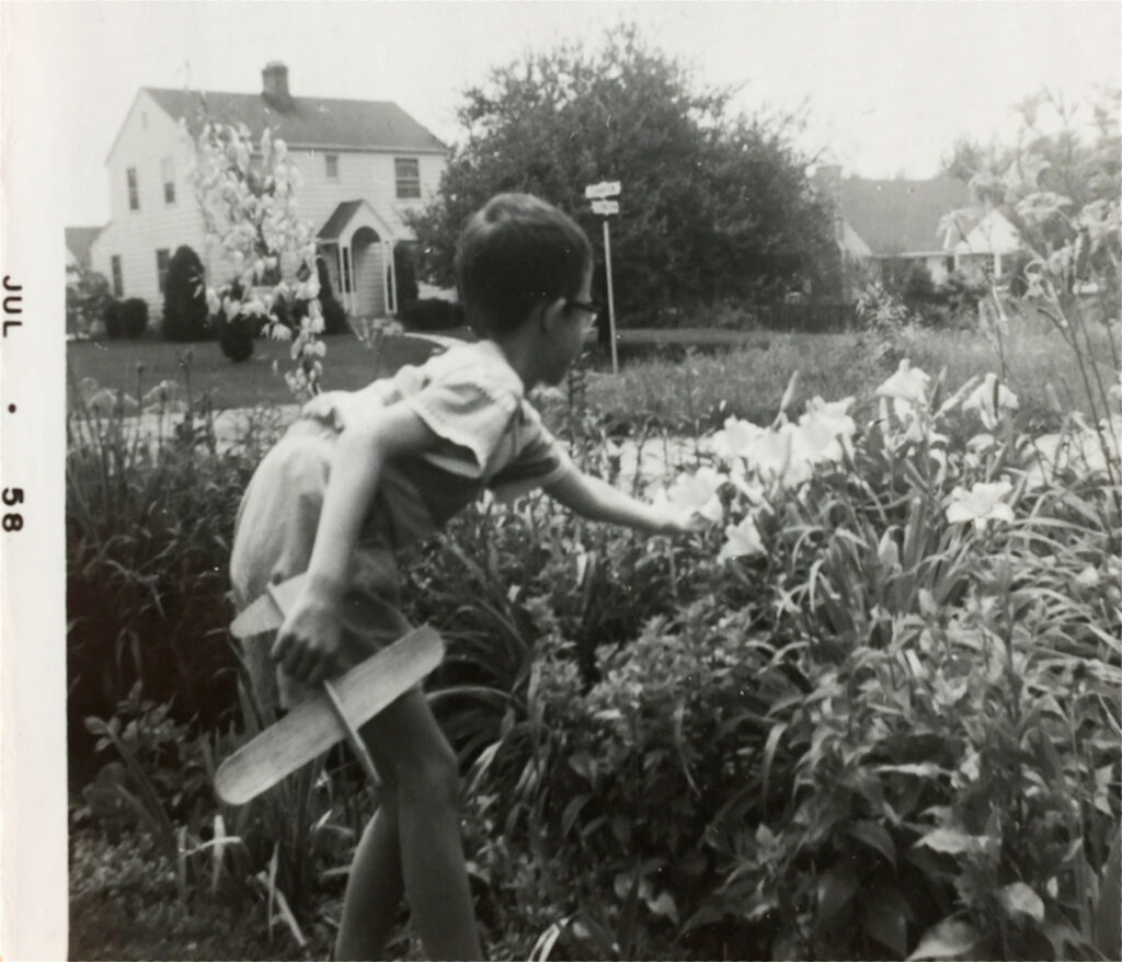 My brother Byron admiring mom's flowers