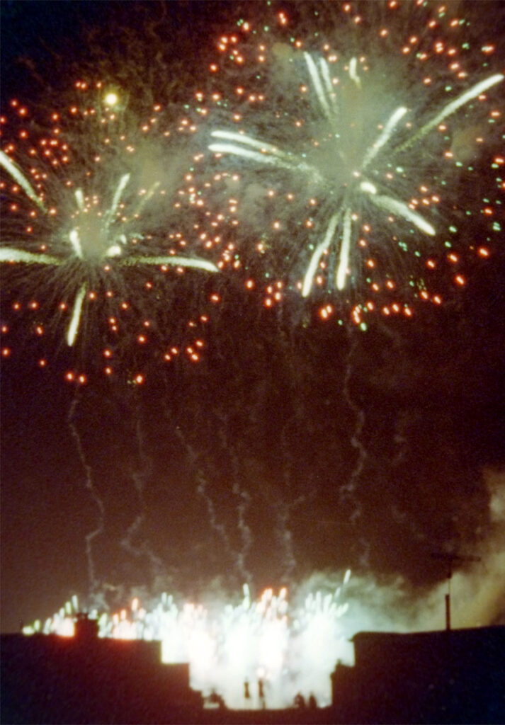 Ektramax fireworks beyond a building