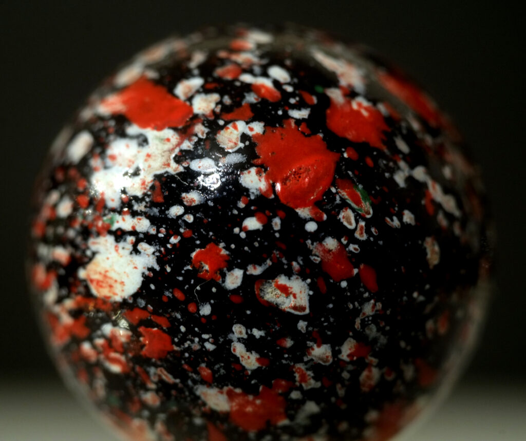 A ploychrome-on-black "Glitterbomb" marble