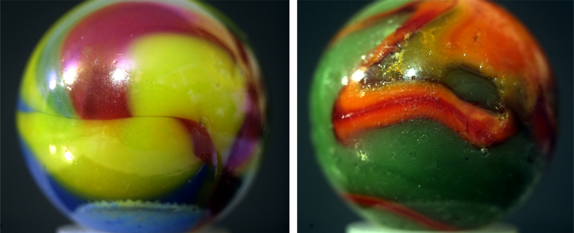 Two multicolored opaque marbles (possibly Peltier and Akro Agate)