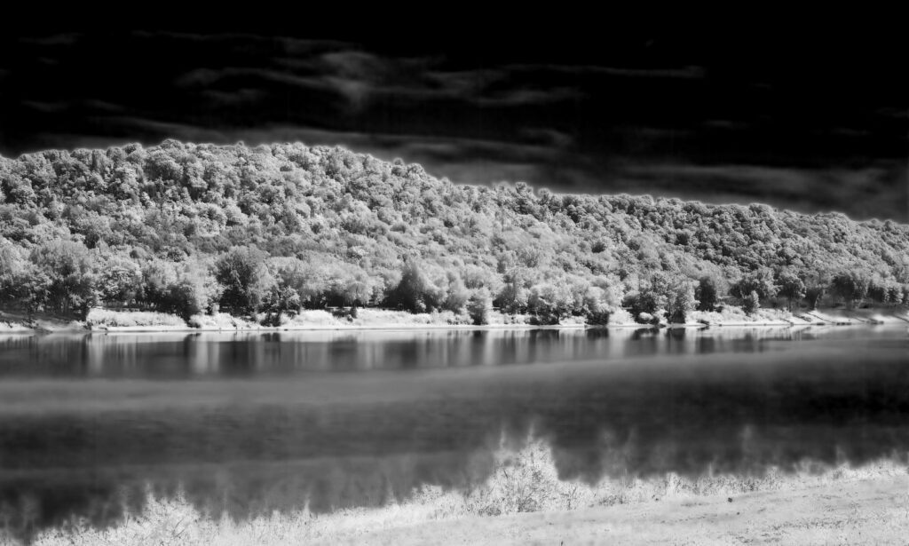 River with sky darkened dramatically