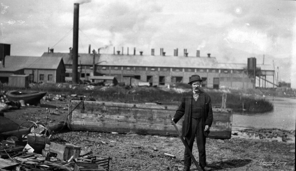 Factory worker in front of the factory.