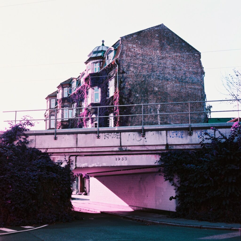 Bridge and apartment building shot on Lomo Purple with Rolleicord Va