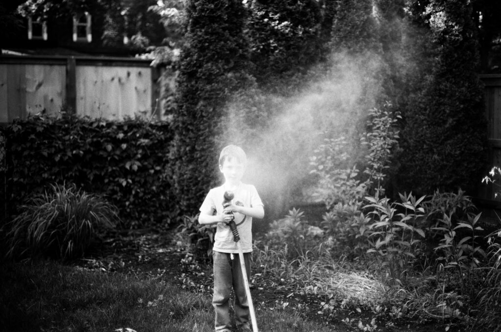 Boy with water hose