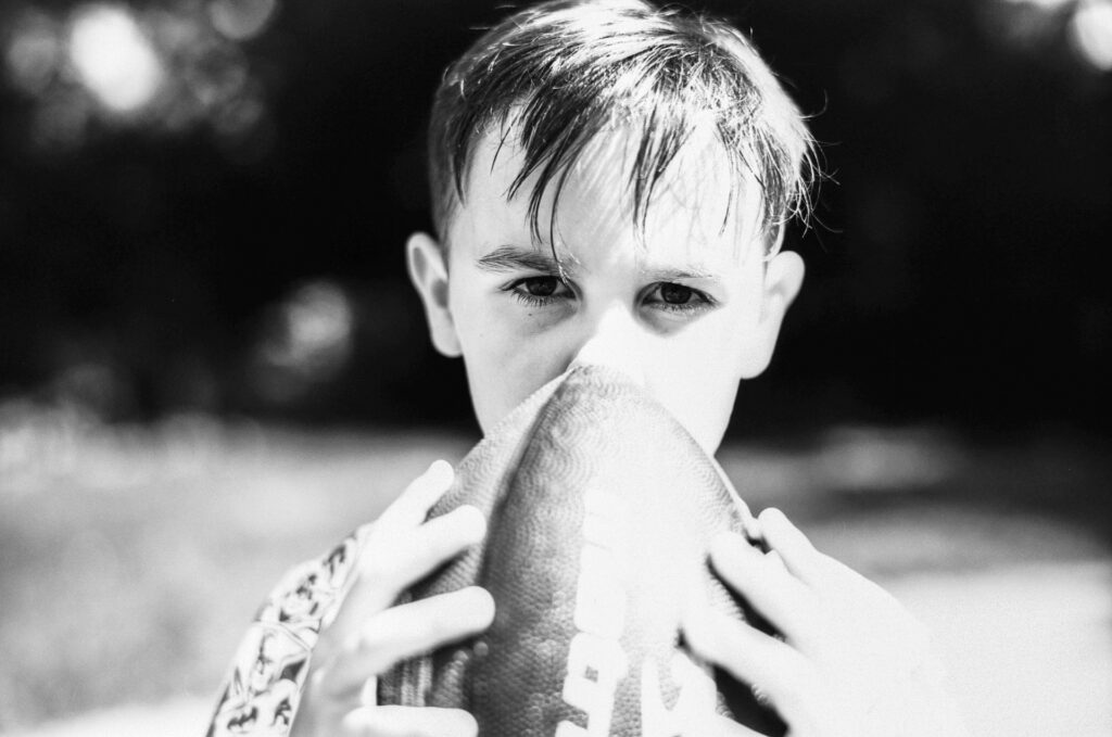 Boy Holding Football