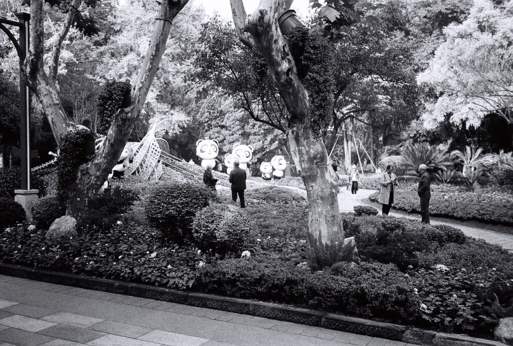 An ornamental space containing flowers and panda figures.