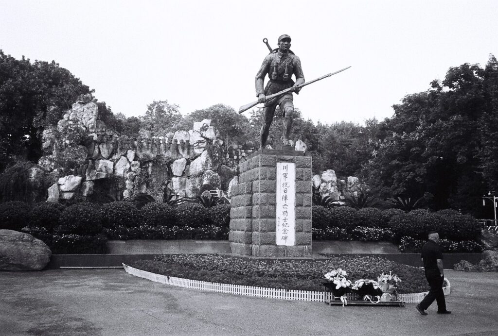 A monument depicting a soldier holding a rifle and bayonet.