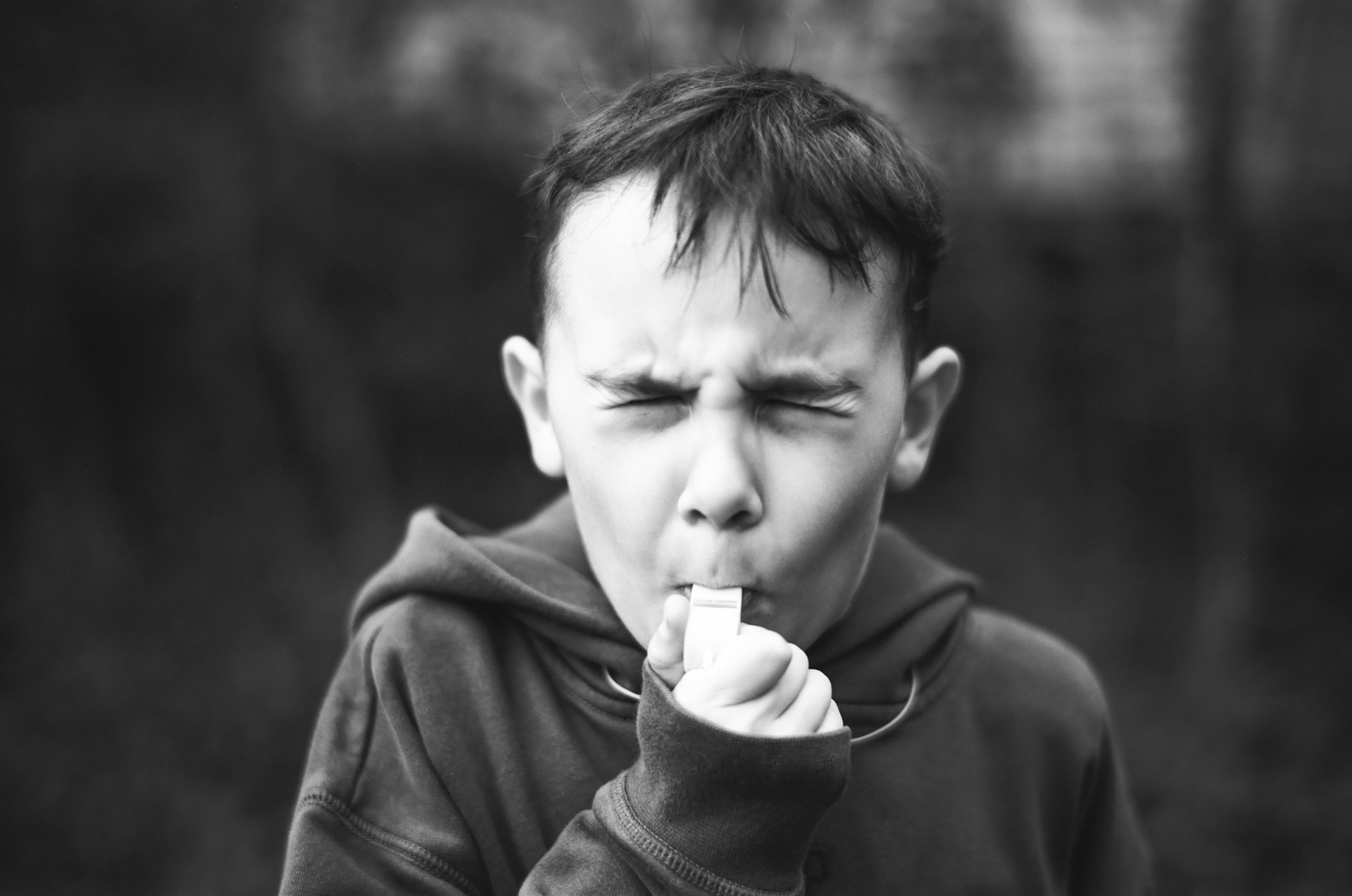 Boy blowing whistle