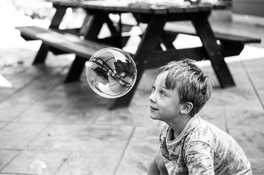 Boy looking at bubble