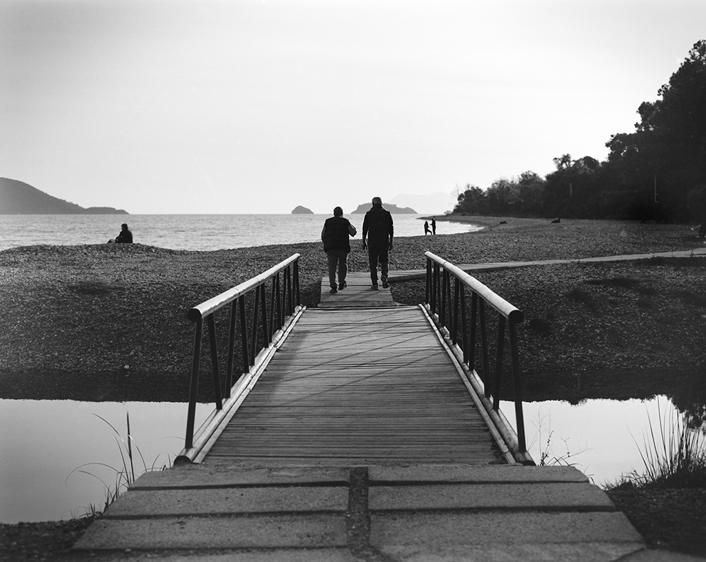 Two men crossing a bridge near Fethiye, Turkey