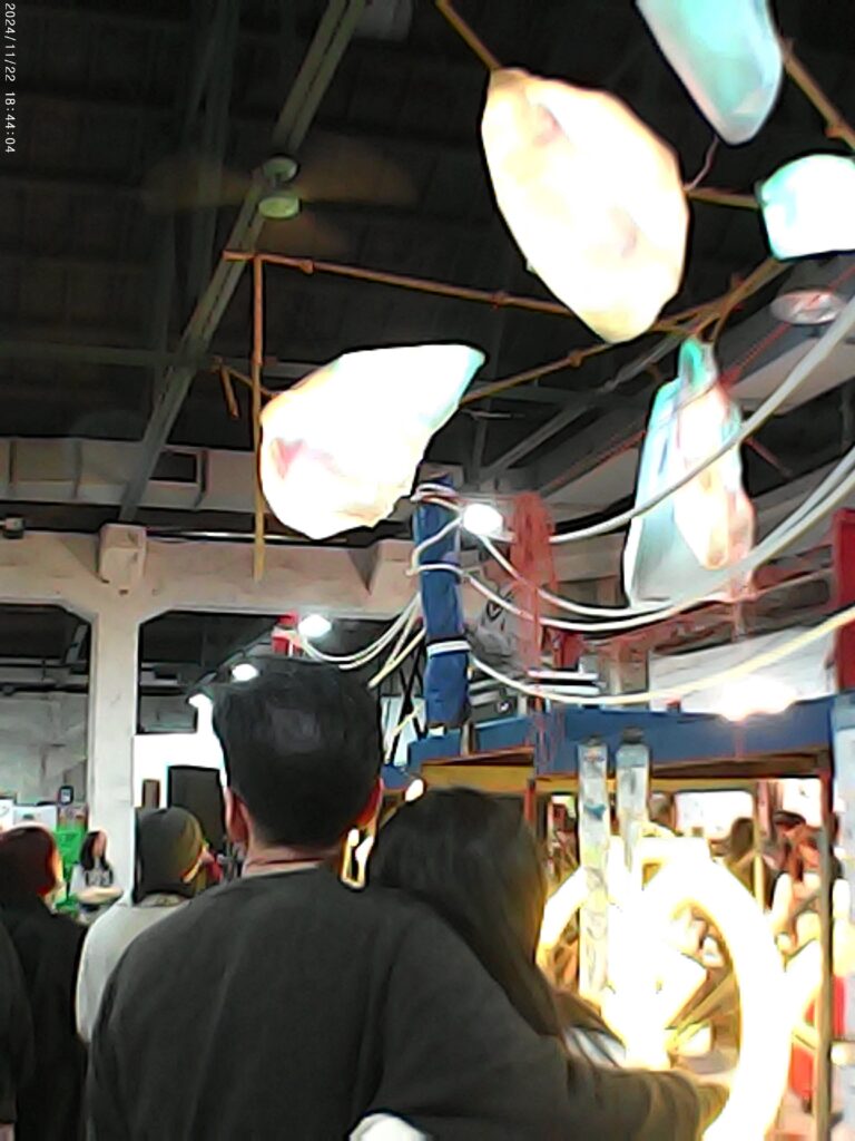 A couple watches a piano performance at the Taipei Artbook Fair.