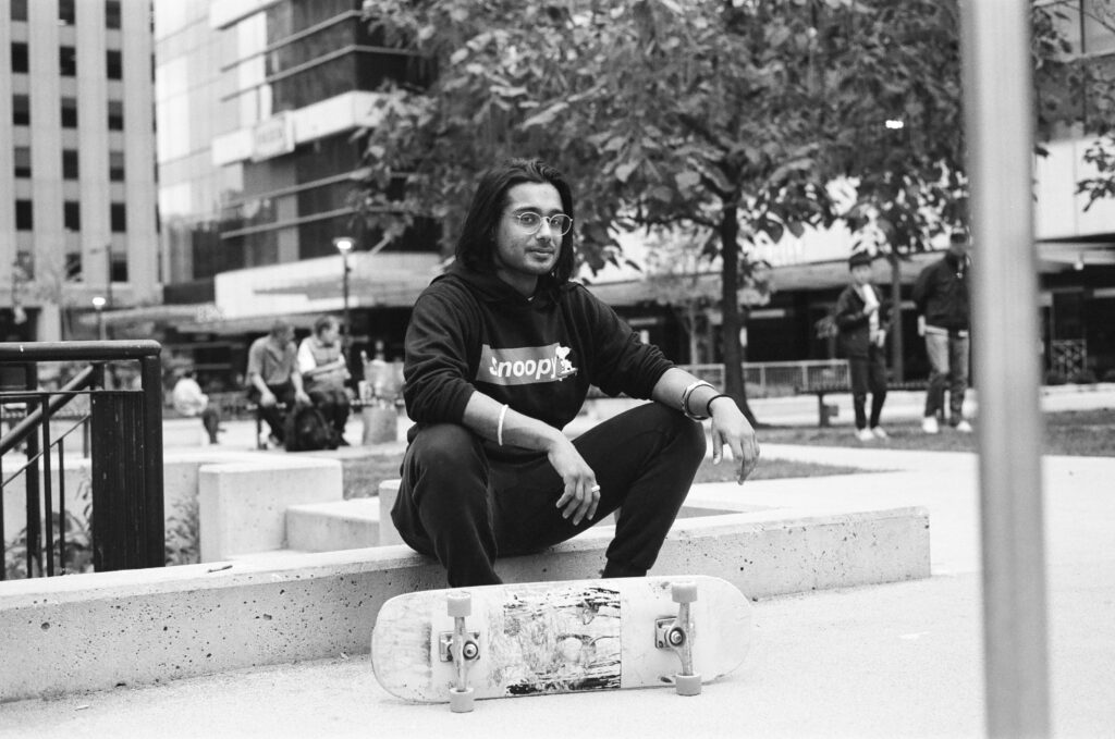 Man posing with skateboard