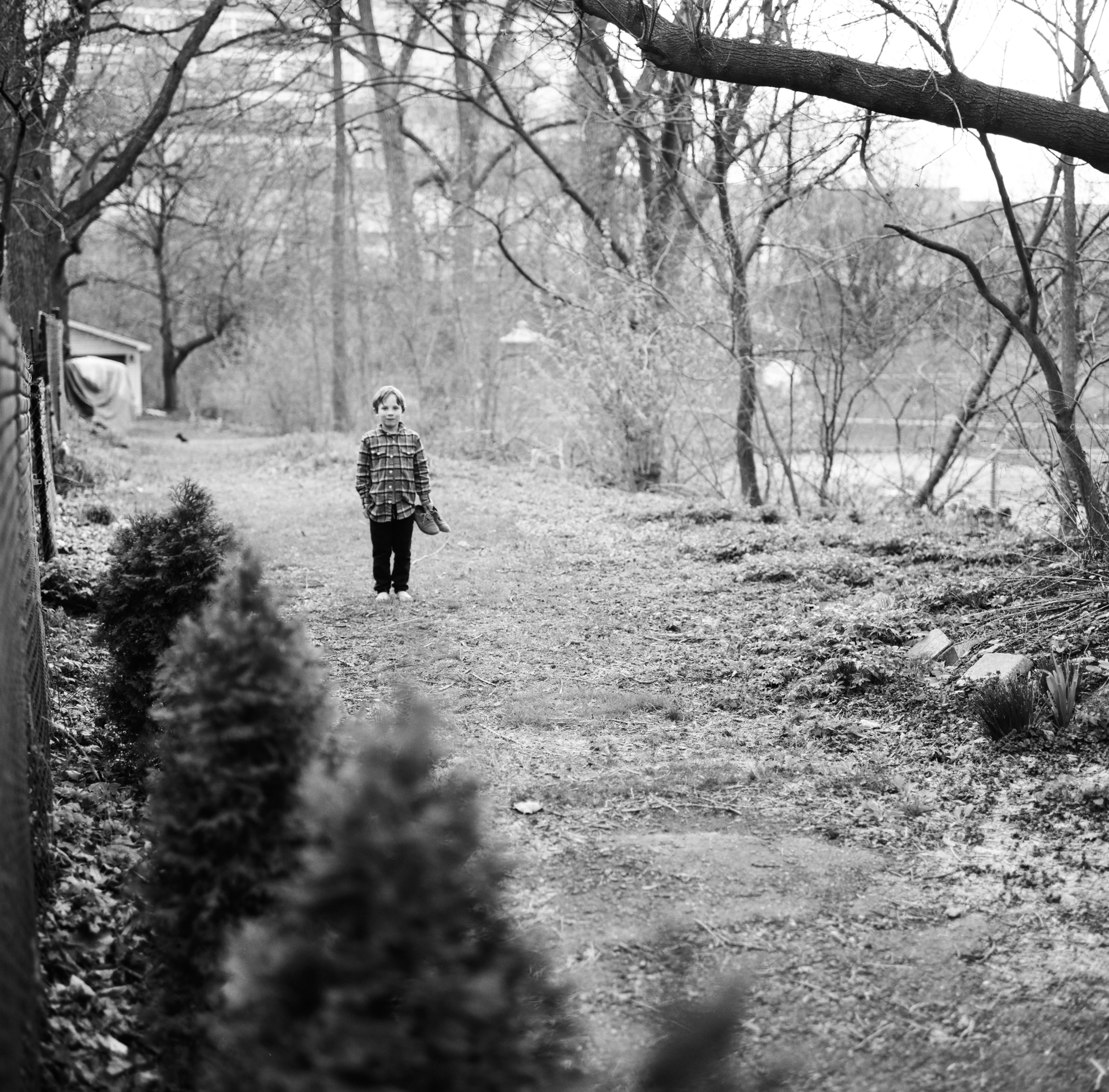 Boy carrying shoes