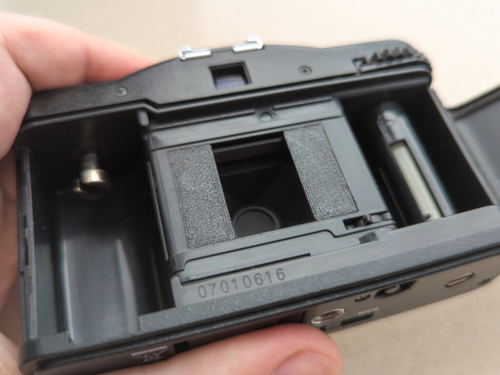 The frame window of the Lomo LC-A with the installed mask insert that sets a new format and frame size.