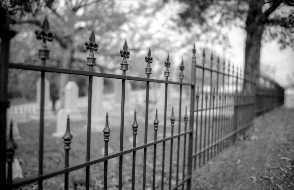 new iron fence replicating old fencing 