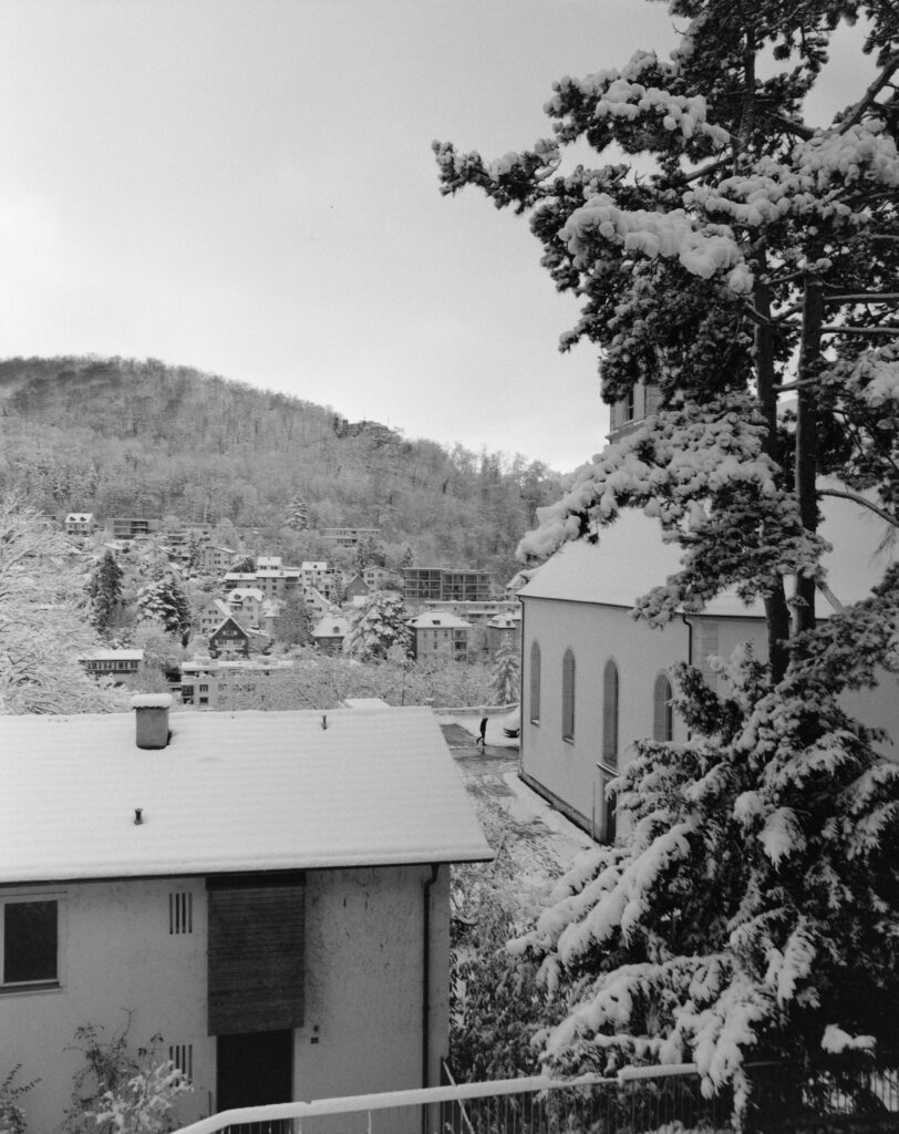 Snowy city "Baden" as seen from Office