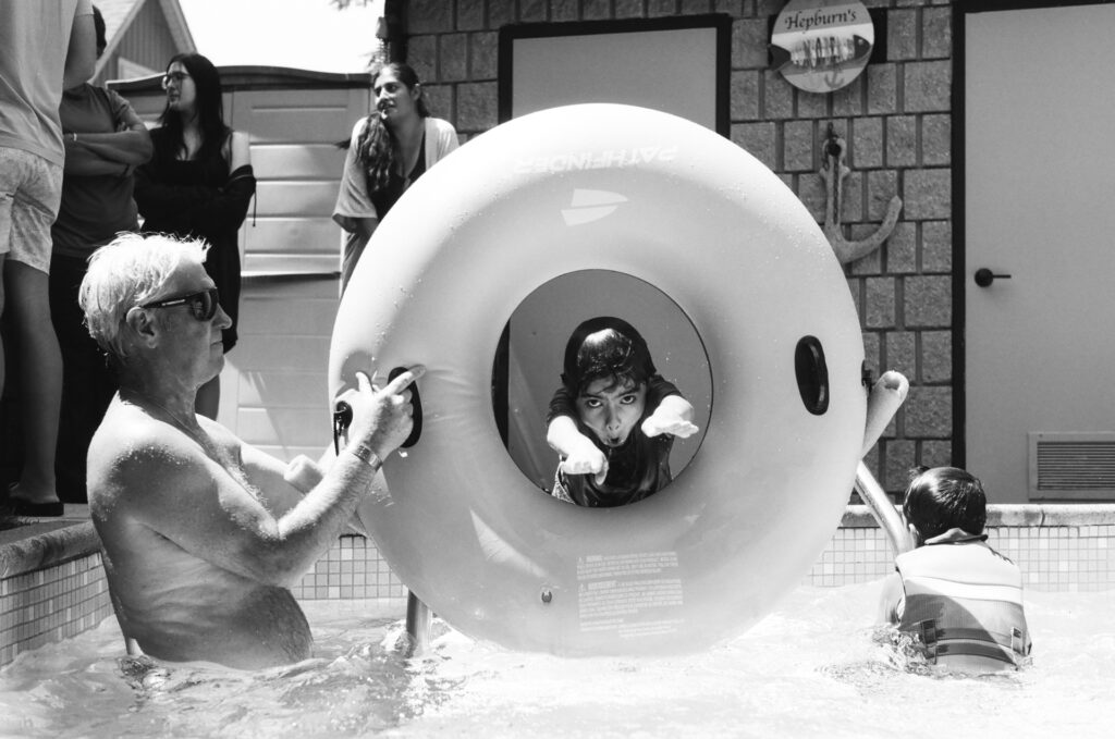 Boy jumping through donut